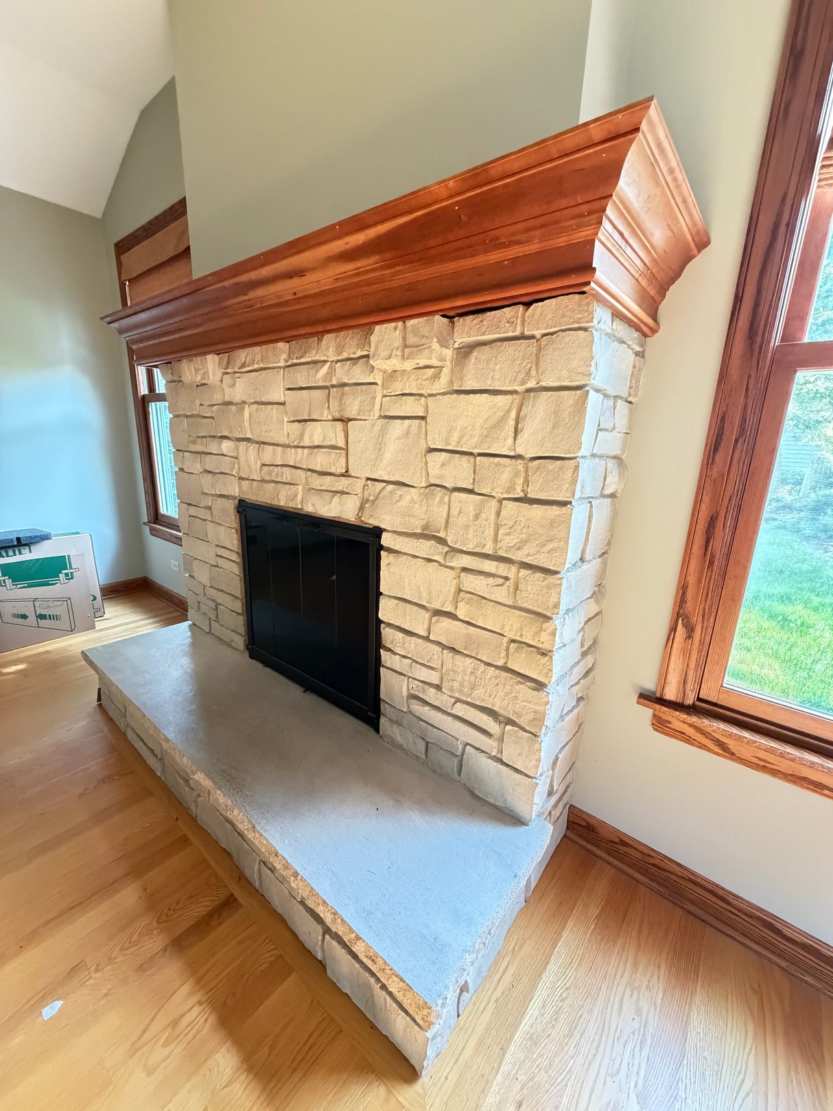 Stone Veneer Fireplace Surround w/ Wood Mantel & Glass Doors