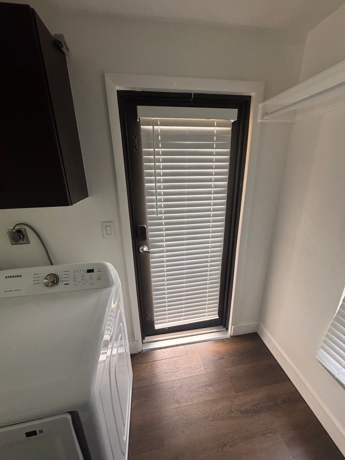 Modern Black Framed Glass Exterior Door with Built-In Blinds