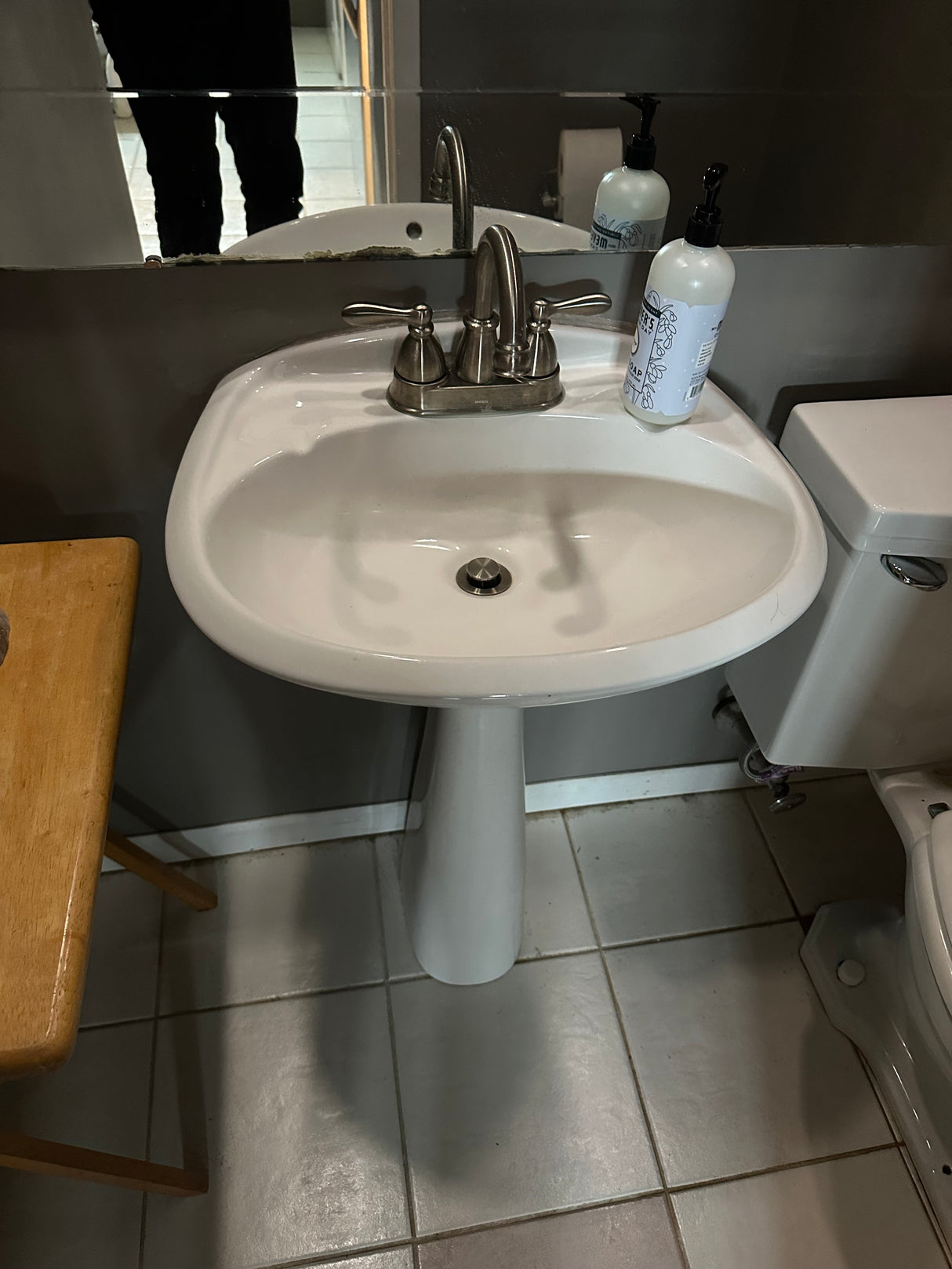 White Pedestal Sink with Moen Faucet